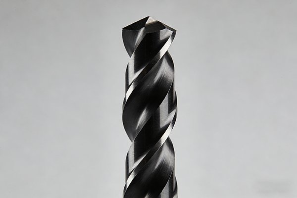 A close-up view of a black TiAlN coated drill bit.