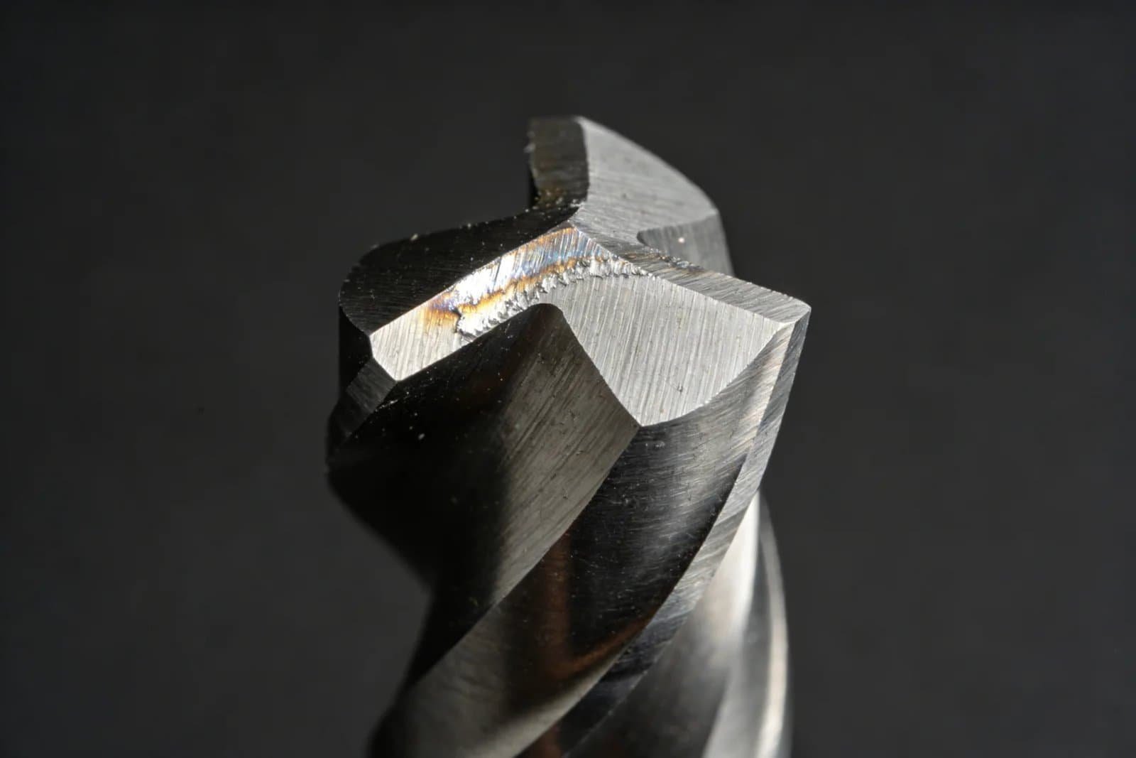 Close-up of an end mill tip showing flank wear