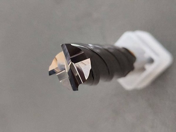 A close-up shot of a solid carbide end mill's flutes